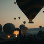 Sunrise balloon rides over ancient valleys