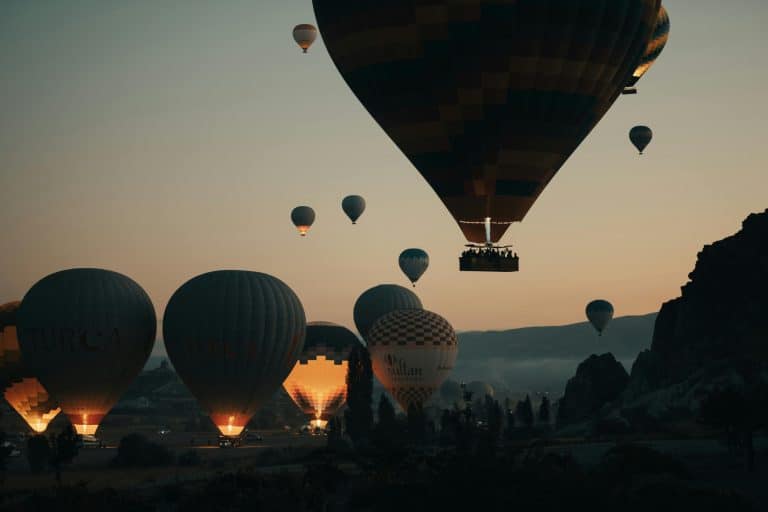 Sunrise balloon rides over ancient valleys